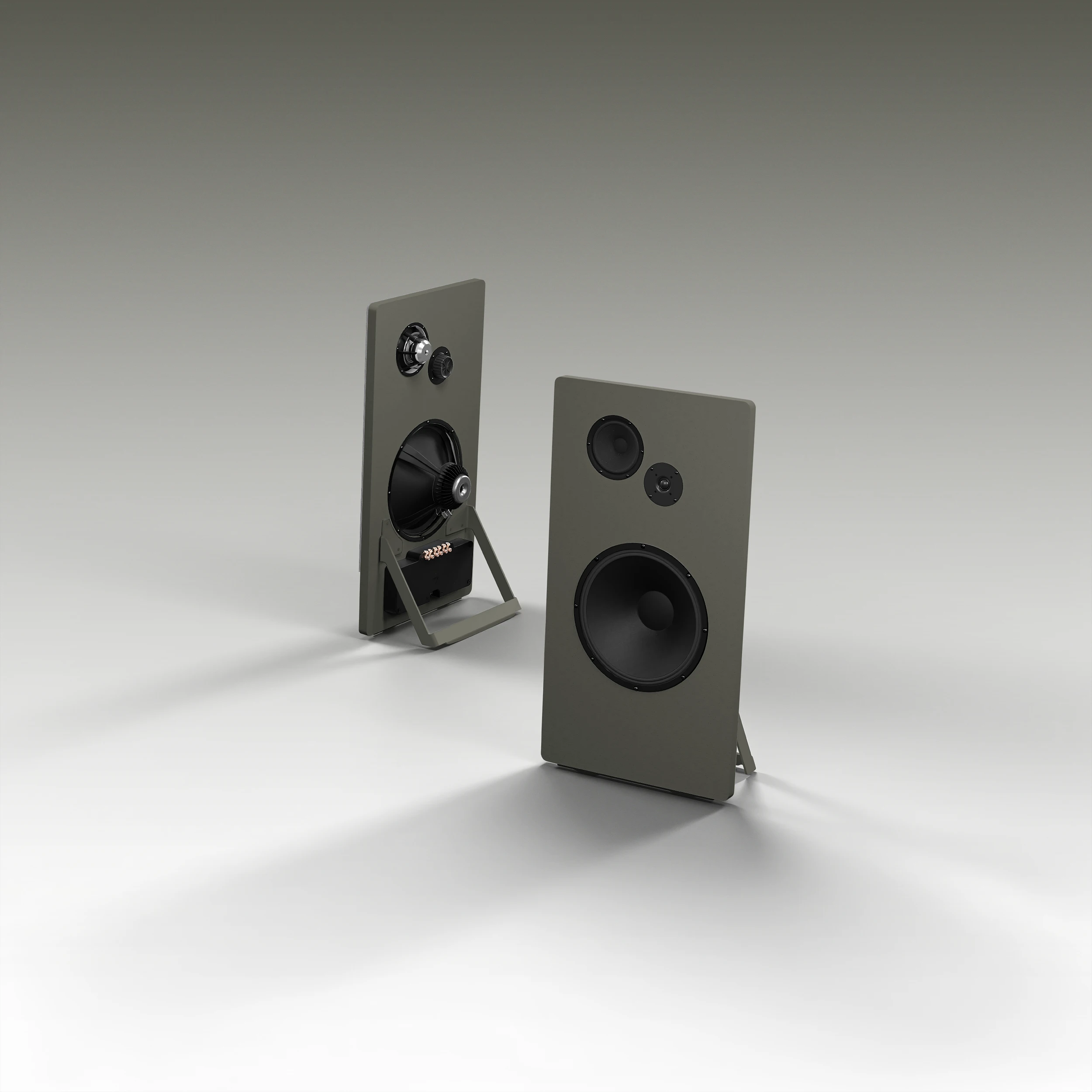 Pair of modern rectangular speakers in green with multiple black speaker cones, shown on a light surface with shadows.