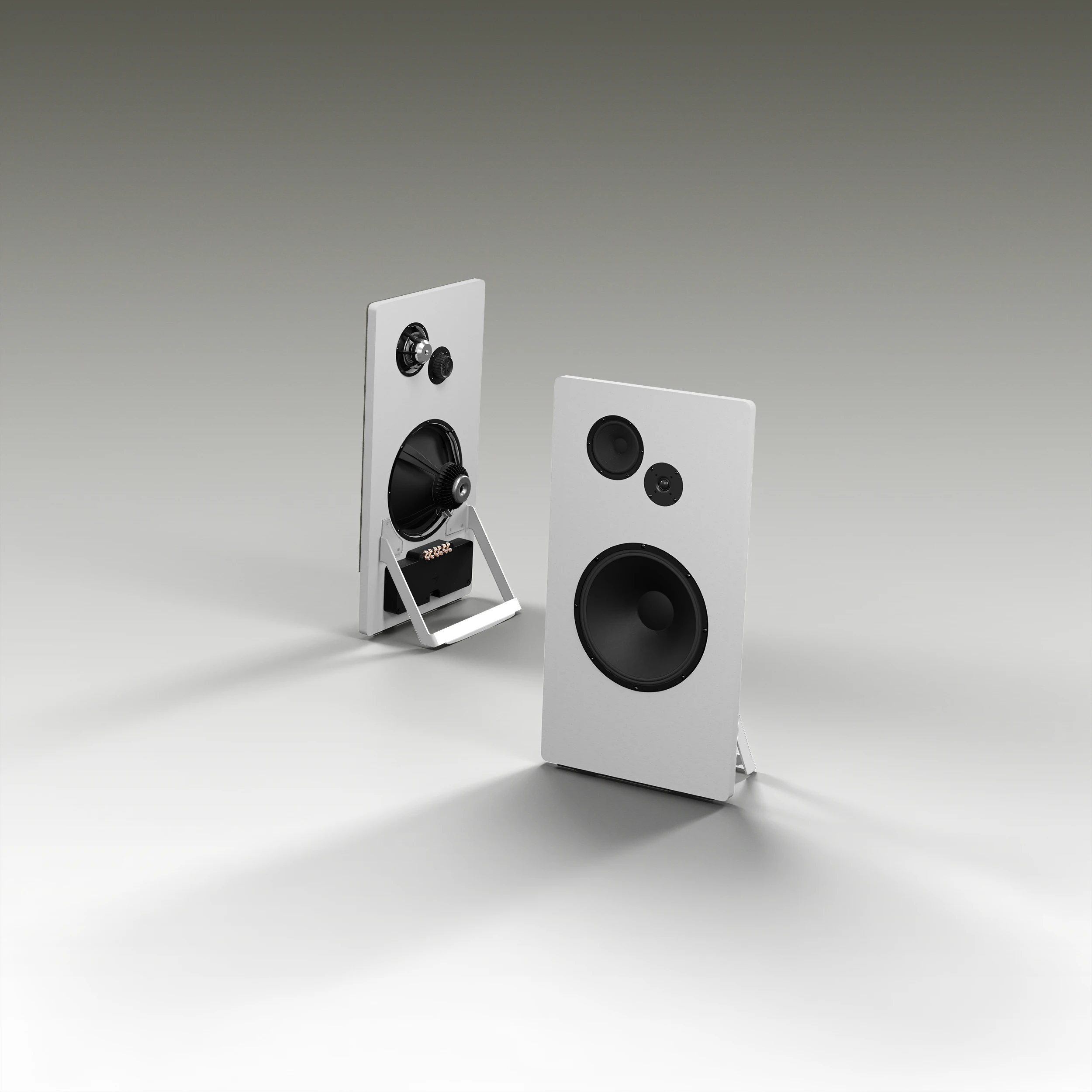 Pair of modern white freestanding speakers with black drivers, one showing front view and the other back view.