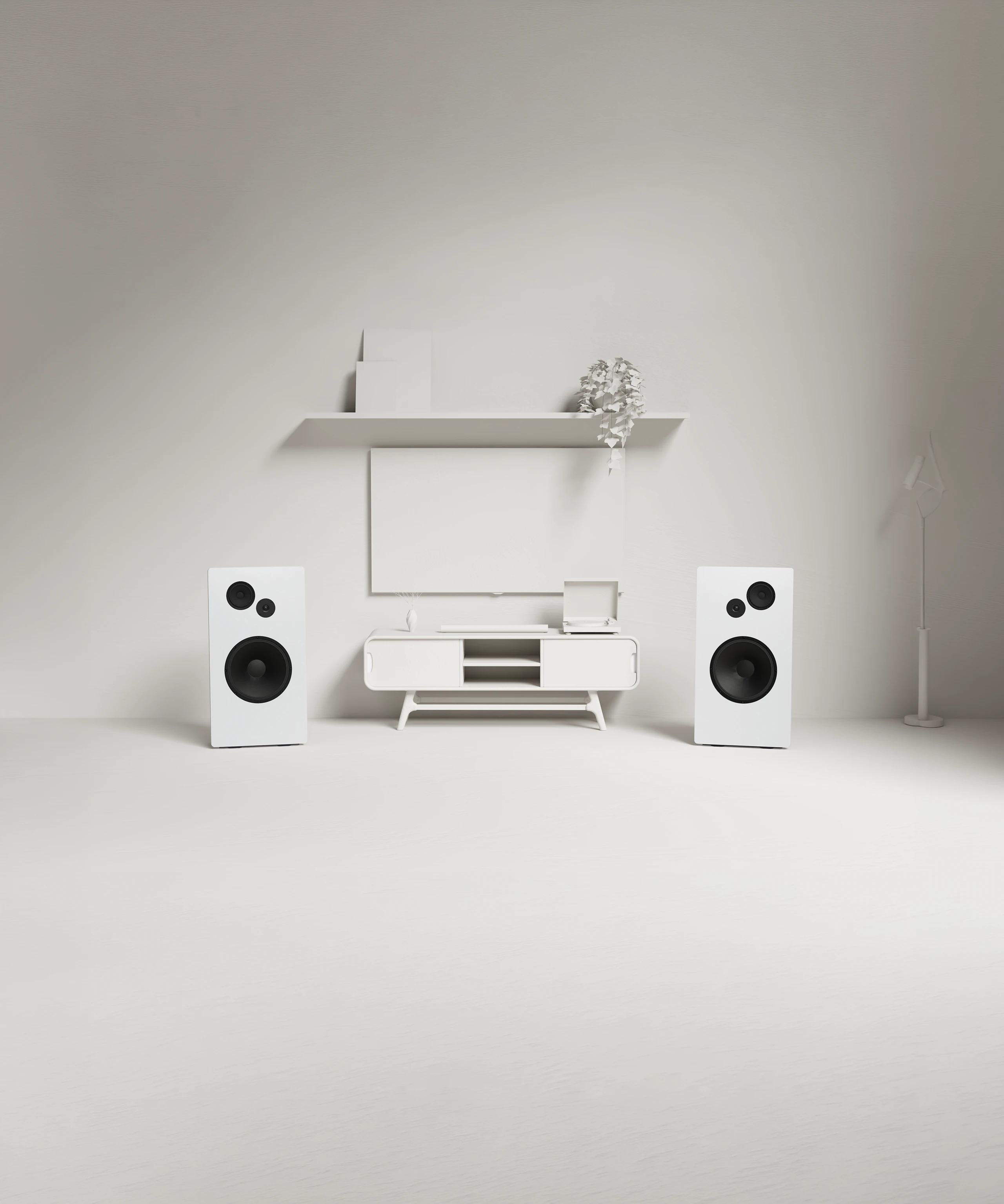 Minimalist modern living room setup with two white speakers flanking a white TV console, a blank wall-mounted TV, and a white floor lamp.